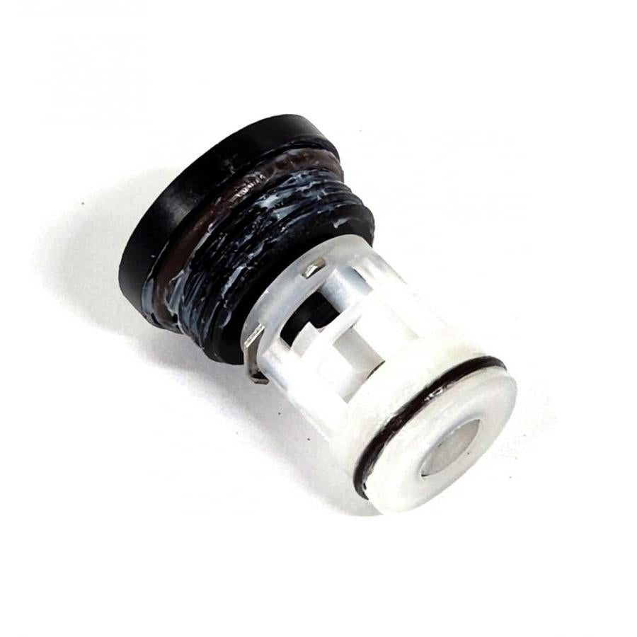 Replacement faucet cartridge with a black threaded cap, white plastic body, and black rubber O-ring seal.