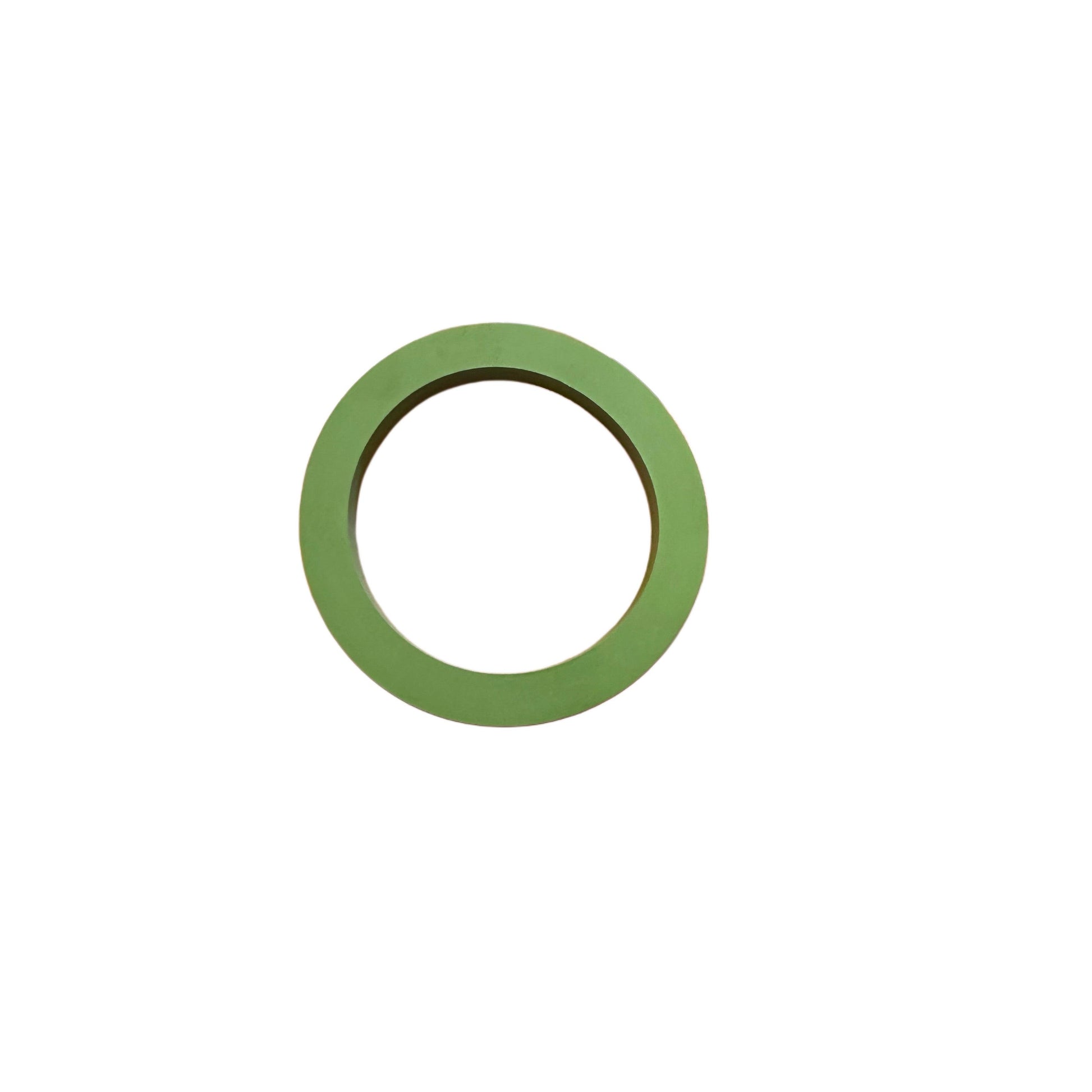 Flat, circular green rubber gasket ring with a smooth surface isolated on a white background.