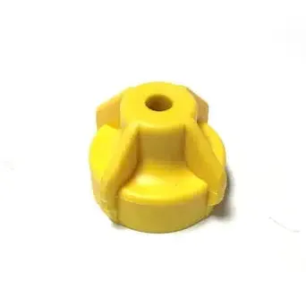 Small yellow plastic cap with a central hole and reinforced ribbed design for secure industrial fastening.