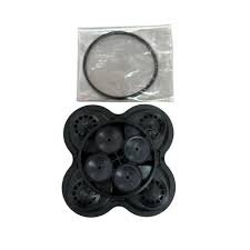 Black plastic four-port manifold assembly with a circular rubber O-ring seal in a clear plastic bag.